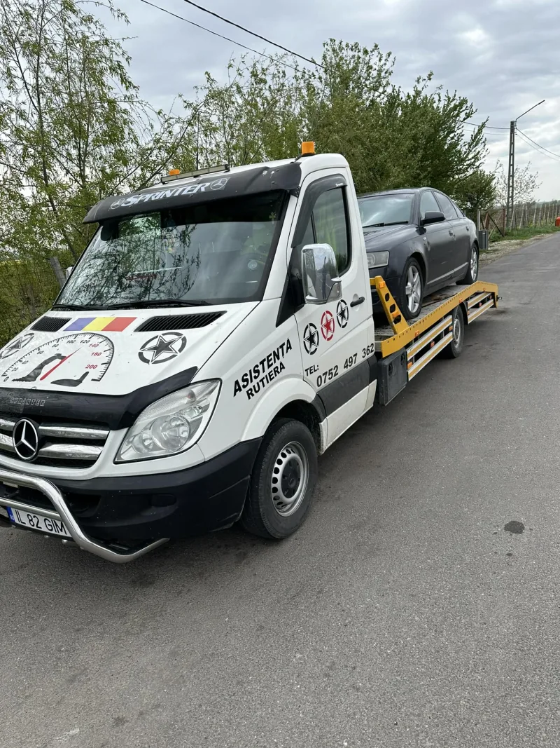Tractări auto Fetești — autospecială pe platformă